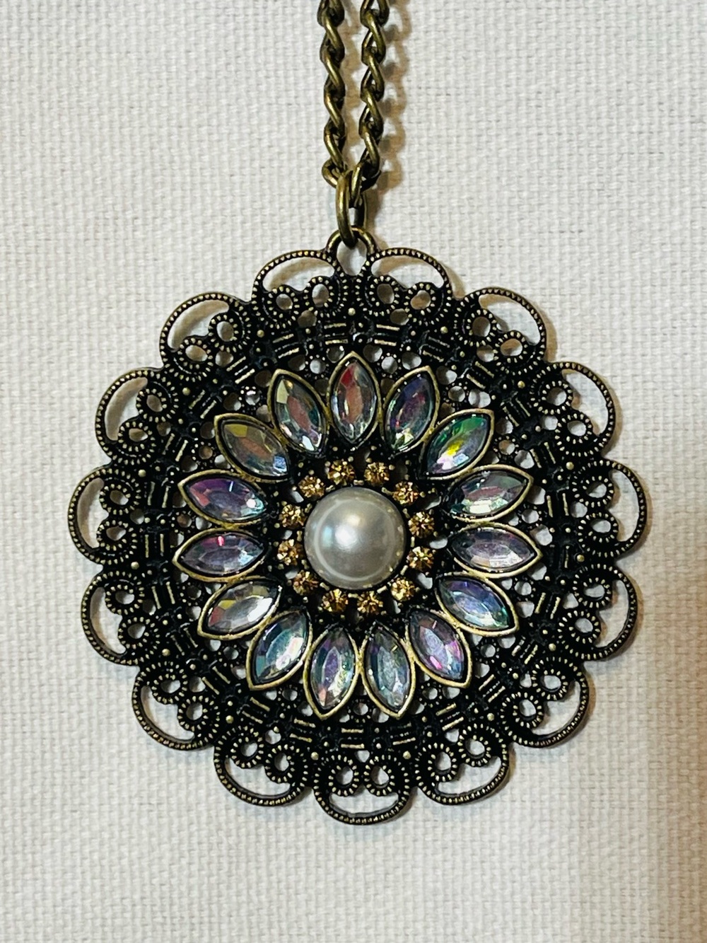 Antique-Style Black Floral Pendant Necklace with Iridescent Center